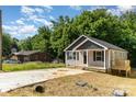 Lovely single Gathering home displays new construction, gray siding, and a concrete driveway at 314 Adams St, Salisbury, NC 28144