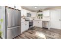 Bright kitchen with stainless steel appliances, sleek countertops, and modern white cabinetry at 319 Leonard Ave, Albemarle, NC 28001
