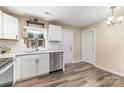 Well-lit kitchen featuring stainless steel dishwasher and a stylish backsplash at 319 Leonard Ave, Albemarle, NC 28001
