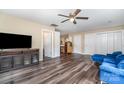 Spacious living room features modern flooring, neutral paint and easy access to kitchen at 319 Leonard Ave, Albemarle, NC 28001
