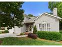 Charming stucco home with a well-maintained front yard and attached two-car garage at 4101 Fairway Downs Ct # 9, Charlotte, NC 28277