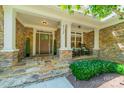 Charming front porch with stone accents and space for seating at 4319 Sailview Dr, Denver, NC 28037
