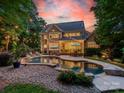 Stunning outdoor living space with pool, deck, patio, and landscape lighting at 4319 Sailview Dr, Denver, NC 28037