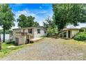 Lakeside home with deck and outbuilding at 4920 Longfield St, Claremont, NC 28610