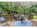 Covered back porch with comfortable seating, perfect for outdoor relaxation at 511 Apple Ln, Bessemer City, NC 28016