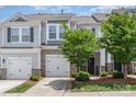 Charming townhome with stone accents, attached garages, and well-maintained landscaping at 724 Little Bluestem Dr, Lake Wylie, SC 29710