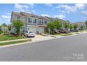 A street view shows a row of townhomes in a well-kept suburban neighborhood at 724 Little Bluestem Dr, Lake Wylie, SC 29710