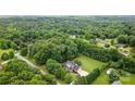 A beautiful home surrounded by lush trees on a large lot at 803 Freeman Rd, Concord, NC 28025