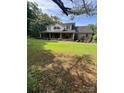 Charming two-story brick home with a welcoming covered porch and mature landscaping at 803 Freeman Rd, Concord, NC 28025