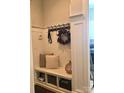 Cozy mudroom with built-in bench seating, storage cubbies, and stylish wall hooks at 104 Bunker Way # 1001, Mooresville, NC 28117