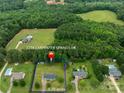 Aerial view of a property that is 0.70 acres and close to neighborhood homes with pools and mature trees at 1274 Carpenter Springs Dr, Dallas, NC 28034