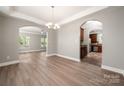 Formal dining room with hardwood floors leading to kitchen and living spaces at 14034 Cedar Pond Cir, Huntersville, NC 28078