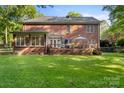 Expansive backyard with a large deck perfect for outdoor entertaining at 4389 Enchantment Cove Ln, Charlotte, NC 28216