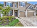 Charming front entrance with stone accents, a cozy porch, and well-maintained landscaping at 5957 Redwood Pine Rd, Concord, NC 28027