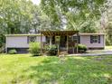 Charming single-story house with a covered porch and well-maintained lawn at 615 Hawley Rd, McConnells, SC 29726