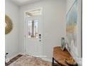 Welcoming foyer with a stylish front door, natural light, and a decorative table with accents at 6423 Mallow Crossing Ln, Charlotte, NC 28213