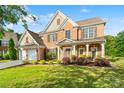 Beautiful two-story home with brick and siding exterior, lush lawn, and well-maintained landscaping at 6430 Stirling Ln, Indian Land, SC 29707