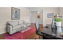 Well-lit office area with stylish decor, and a comfortable sofa and desk setup at 1036 Squire Dr, Fort Mill, SC 29707