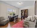 Comfortable office space featuring a bookshelf and a large window at 1036 Squire Dr, Fort Mill, SC 29707