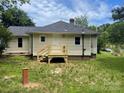 Rear view of home showing new deck and yard at 1327 Wiscassett St, Albemarle, NC 28001