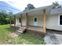 Inviting covered front porch with wood columns and plenty of space for relaxing at 1327 Wiscassett St, Albemarle, NC 28001