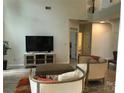 Comfortable living room with a tv, fireplace, neutral color scheme, and access to other rooms, offering relaxing ambiance at 1572 Edenton Nw St, Concord, NC 28027