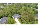 Stunning aerial view of a secluded home surrounded by lush, mature trees, highlighting its privacy at 2504 Korbel Ct, Waxhaw, NC 28173