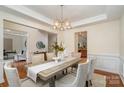 Bright dining room showcasing hardwood floors, a stylish light fixture, and elegant decor for entertaining guests at 2504 Korbel Ct, Waxhaw, NC 28173