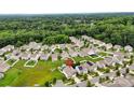 Aerial view of a suburban neighborhood with lush greenery and well-maintained houses at 2515 Walnut Forest Dr, Charlotte, NC 28216
