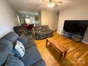 Inviting living room with hardwood flooring and entertainment center; perfect for relaxation at 405 Jose St, Shelby, NC 28150