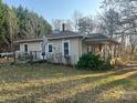 Cozy single-story home displaying a charming architectural design and a well-maintained lawn at 4112 Hill Haven Dr, Vale, NC 28168