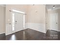 Spacious foyer with dark wood floors, white trim, and a large front door with sidelights at 4352 Haddington Dr, Fort Mill, SC 29707