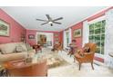 Comfortable living room with plush seating, a ceiling fan, and natural light at 4630 Woodleaf Rd, Salisbury, NC 28147