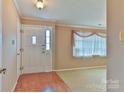 Inviting entryway with a white front door, tile floor and window at 466 Shiloh Church Rd, Hickory, NC 28601