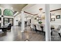 Elegant dining area showcasing hardwood floors, a decorative chandelier, and an open layout at 524 Wildbrook Walk, Fort Mill, SC 29708