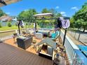 Outdoor deck area featuring ample seating, a pergola, and a fenced in backyard at 533 Tuckers Grove Rd, Statesville, NC 28625