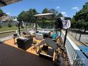 Inviting deck features cozy furniture, including a sofa, swinging egg chair and a gazebo, perfect for relaxing or entertaining at 533 Tuckers Grove Rd, Statesville, NC 28625