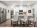 Modern kitchen with stainless steel appliances, a large island, and ample cabinet space at 7530 Porrera St, Charlotte, NC 28214