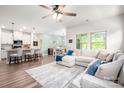 Bright and open living space featuring a large sectional sofa and stylish decor at 7530 Porrera St, Charlotte, NC 28214