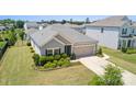 Beautiful single-story home with a well-manicured lawn and a two-car garage in a residential neighborhood at 8406 Flint Hill Dr, Charlotte, NC 28273