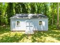 Well-maintained shed in a grassy backyard offering ample storage space at 8938 Glencroft Rd, Mint Hill, NC 28227