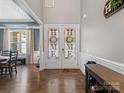 Beautiful double front doors with elegant decor and hardwood floors at 1006 Wellington Ave, Indian Land, SC 29707