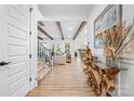 Stunning foyer features wood beams, hardwood floors, and an open floor plan at 1149 Rosecliff Dr, Waxhaw, NC 28173