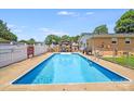 Inviting backyard pool with a gazebo and privacy fencing, perfect for relaxation at 1204 N 12Th St, Bessemer City, NC 28016