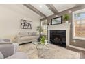 Bright living room showcasing a fireplace with mantel, gray accent wall and comfortable seating at 1776 Baylor Dr, Rock Hill, SC 29732