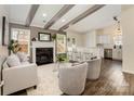 Open-concept living room with a fireplace, bar seating, and view into the adjacent kitchen at 1776 Baylor Dr, Rock Hill, SC 29732