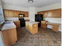 Well-lit kitchen features a functional island and modern appliances at 18414 Victoria Bay Dr, Cornelius, NC 28031