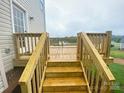 Wooden deck features stairs leading down to the backyard at 1872 Terrain Nw Dr, Conover, NC 28613