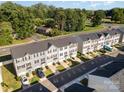 Aerial shot featuring a community of townhomes, manicured lawns, and convenient street parking at 2037 Langer St, Charlotte, NC 28214