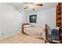 Comfortable bedroom with tile floors, neutral tones, and an overhead ceiling fan at 2255 Milton Rd, Charlotte, NC 28215